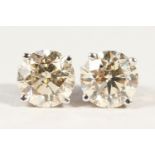 A PAIR OF SUBSTANTIAL 18CT WHITE GOLD DIAMOND STUD EARRINGS OF 3.2cts.