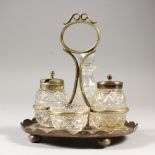 A FOUR PIECE CUT GLASS CRUET SET, on an embossed stand. 6ins wide.