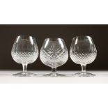 A PAIR OF WATERFORD CRYSTAL BRANDY BALLOONS and a similar glass (3). 5ins high.