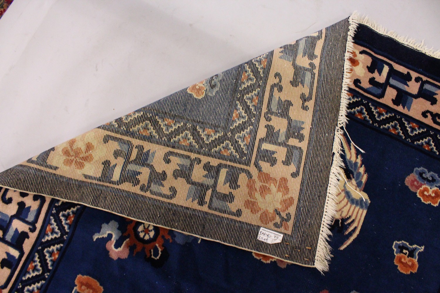 A SMALL CHINESE CARPET, with blue ground, with design of storks. 6ft 9ins x 4ft 4ins. - Image 7 of 8