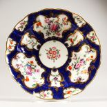 A DR. WALL FIRST PERIOD WORCESTER CIRCULAR PLATE, blue scale border painted with flowers, Chinese