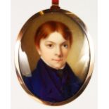 19TH CENTURY ENGLISH SCHOOL, PORTRAIT OF A YOUNG MAN, wearing a blue coat. 2.25ins x 1.75ins.