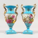 A PAIR OF SEVRES STYLE SMALL PORCELAIN TWIN HANDLED URNS, decorated with flowers. 8ins high.