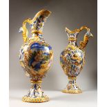 A PAIR OF CANTIGALI FAIENCE EWERS, probably 19th Century, with dragon handles, the bodies
