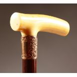 A GOOD IVORY HANDLED WALKING CANE with embossed 9ct gold collar, Chester 1900. 36ins long.