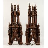 A PAIR OF 19TH CENTURY CARVED WOOD GOTHIC FINIALS. 22ins high.