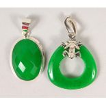 TWO SILVER AND JADE PENDANTS.