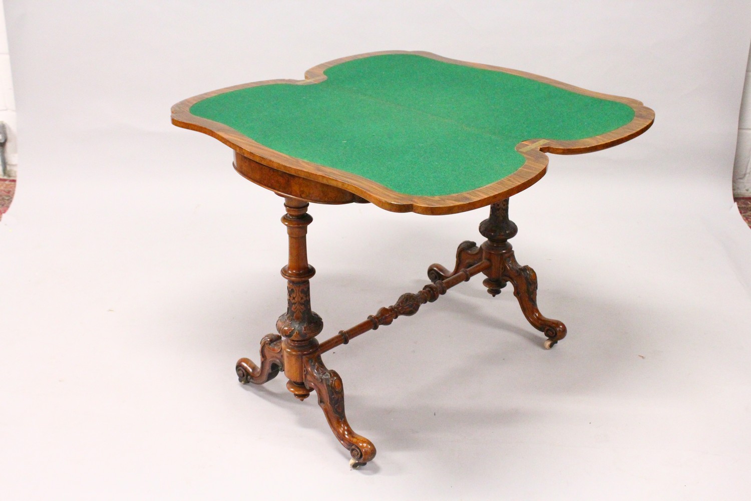 A GOOD VICTORIAN BURR WALNUT SHAPED TOP FOLDOVER CARD TABLE, with a pair of turned and carved column - Image 6 of 12