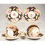 TWO COALPORT PORCELAIN TRIOS, blue and gilt decorated with roses.