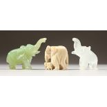 A CARVED JADEITE ELEPHANT, and two others. 2.5ins wide.