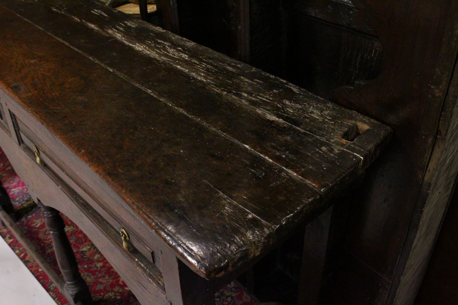 AN EARLY 17TH CENTURY OAK DRESSER, the upper section with shaped pelmet, and two shelves, the twin - Image 2 of 6