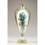A ROYAL WORCESTER PEDESTAL VASE, No. 1957, pale blue ground decorated with floral sprays. 8.5ins