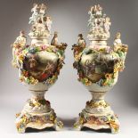 A LARGE PAIR OF MEISSEN STYLE TWIN HANDLED VASES, COVERS AND STANDS, with floral encrusted