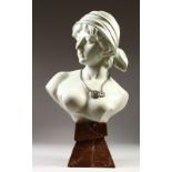 AN ART NOUVEAU STYLE GLAZED POTTERY BUST OF A YOUNG LADY, on a faux marble base. 22ins high.
