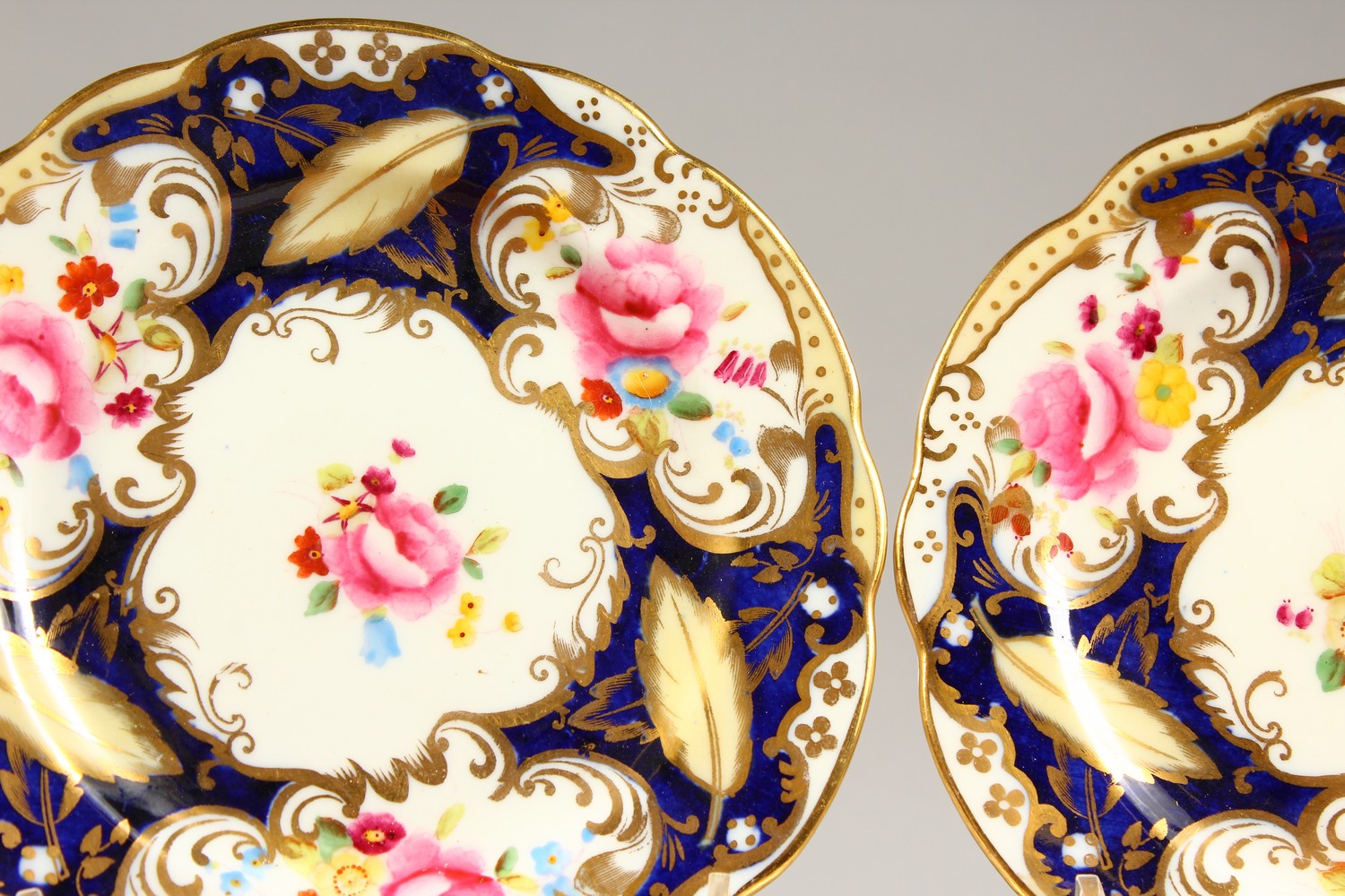 TWO COALPORT PORCELAIN TRIOS, blue and gilt decorated with roses. - Image 2 of 7