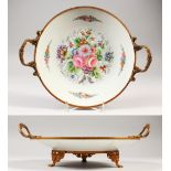 A ROYAL IMPERIAL PORCELAIN CIRCULAR PLATE with ormolu mounts. Signed A. Callot-Gres. 9ins diameter.