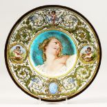 LEON PARVILLEE AND BERTHE ROLLOT, A MAJOLICA CHARGER, the centre painted with a portrait bust of a