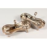 A NEAR PAIR OF OLD SHEFFIELD PLATE KIDNEY SHAPE SNUFFER TRAYS, with two candles snuffers. 7.25ins