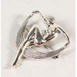 A SILVER ART DECO LADY BROOCH.