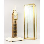 A SKELETON CLOCK, modelled as Big Ben, housed in a glass case. Case 27ins high.