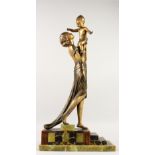 AN ART DECO SPELTER FIGURE, a young mother holding a child in her hands, on a stepped marble and