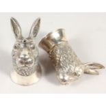 A CAST SILVER PAIR OF RABBIT SALT AND PEPPERS.