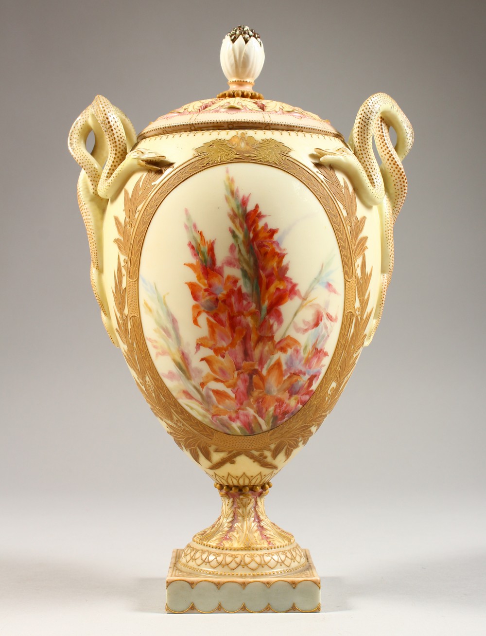 A BLUSH IVORY PORCELAIN TWIN HANDLED POT POURRI VASE, painted with floral sprays, serpentine handles