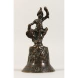 A SMALL BRONZE BELL, with figured handle. 6ins high.