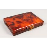 AN ART DECO TORTOISESHELL COMPACT.