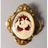 A GOOD VICTORIAN GILT METAL CAMEO STYLE BROOCH, carved with doves.