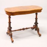 A GOOD VICTORIAN BURR WALNUT SHAPED TOP FOLDOVER CARD TABLE, with a pair of turned and carved column