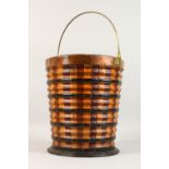 A DUTCH BANDED WOOD BUCKET, with brass handle. 13ins high.