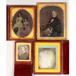 A GROUP OF FOUR LATE 19TH / EARLY 20TH CENTURY PHOTOGRAPHIC PORTRAITS, three in leather folding