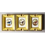 A SET OF THREE LIMOGES PORCELAIN ASHTRAYS painted with birds by JARDIN.