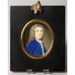 18TH CENTURY ENGLISH SCHOOL, PORTRAIT OF A GENTLEMAN, wearing a wig and a blue coat. 3ins x 2.5ins.