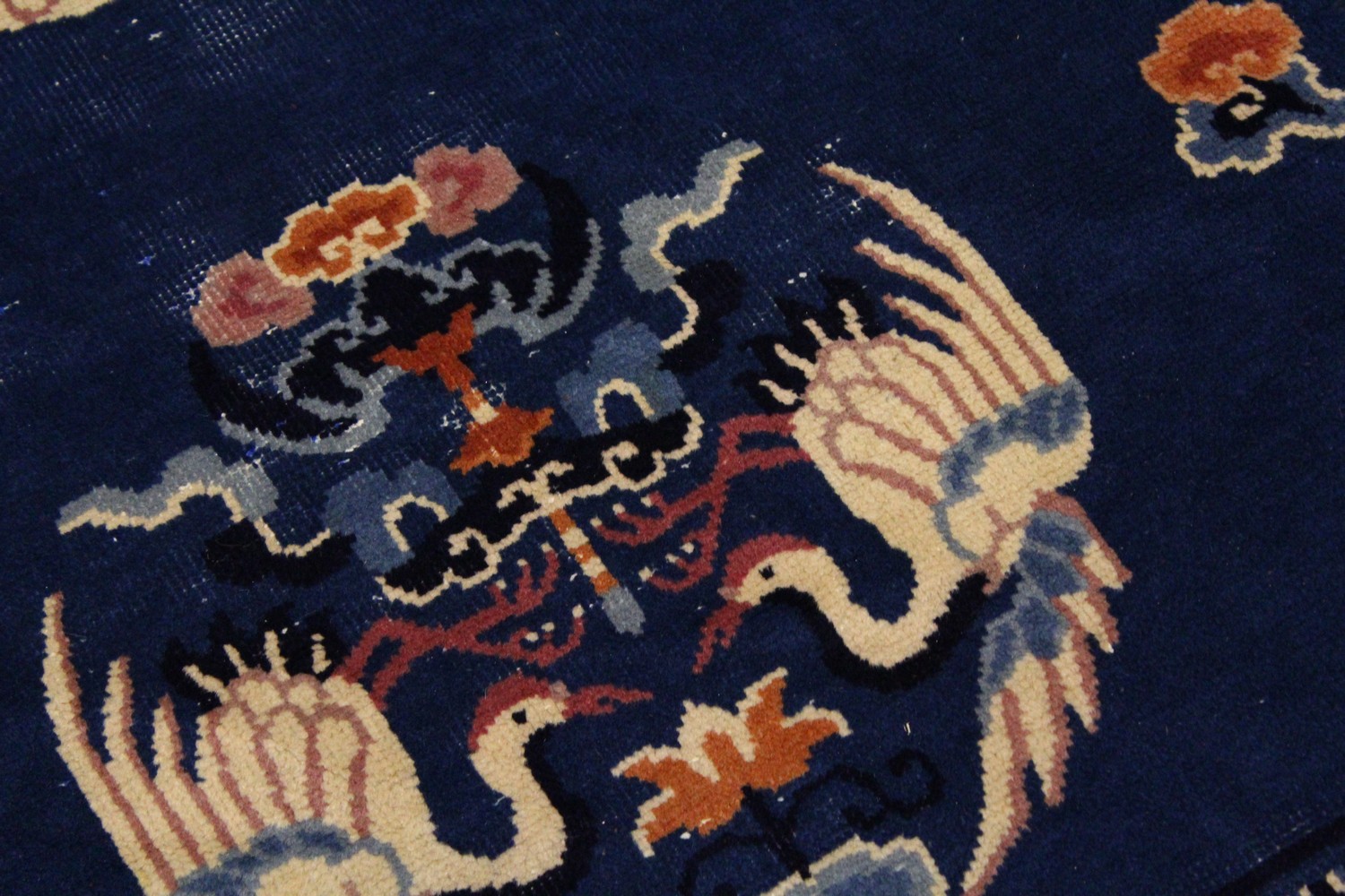 A SMALL CHINESE CARPET, with blue ground, with design of storks. 6ft 9ins x 4ft 4ins. - Image 2 of 8