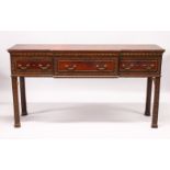 A GEORGE III MAHOGANY BREAKFRONT SIDEBOARD, the top with barber's pole line decoration over three