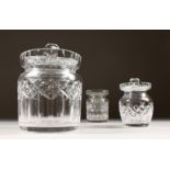 A LARGE CUT GLASS STORAGE JAR WITH LID, and two Waterford Crystal preserve jars (one lacking lid).