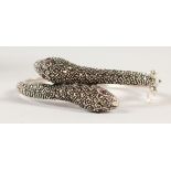 A SILVER AND MARCASITE SNAKE BANGLE.