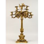 A GOOD 19TH CENTURY ORMOLU NINE LIGHT CANDELABRA of naturalistic form, with scrolling branches, on a