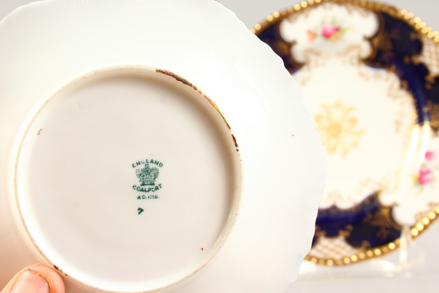 A COALPORT TRIO AND A HAMMERSLEY TRIO, blue and gilt painted with roses. - Image 6 of 7