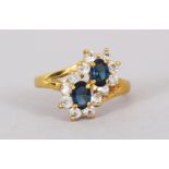 AN 18CT GOLD, DIAMOND AND SAPPHIRE RING.