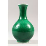 A SMALL 19TH CENTURY CHINESE APPLE GREEN MONOCHROME PORCELAIN VASE, the base with a four-character