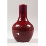 A SMALL 18TH/19TH CENTURY CHINESE FLAMBE BOTTLE VASE, the streaked red glaze turning to purple at