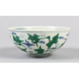 A CHINESE BLUE AND WHITE EGG SHELL PORCELAIN RICE BOWL, green enamel decoration depicting flying