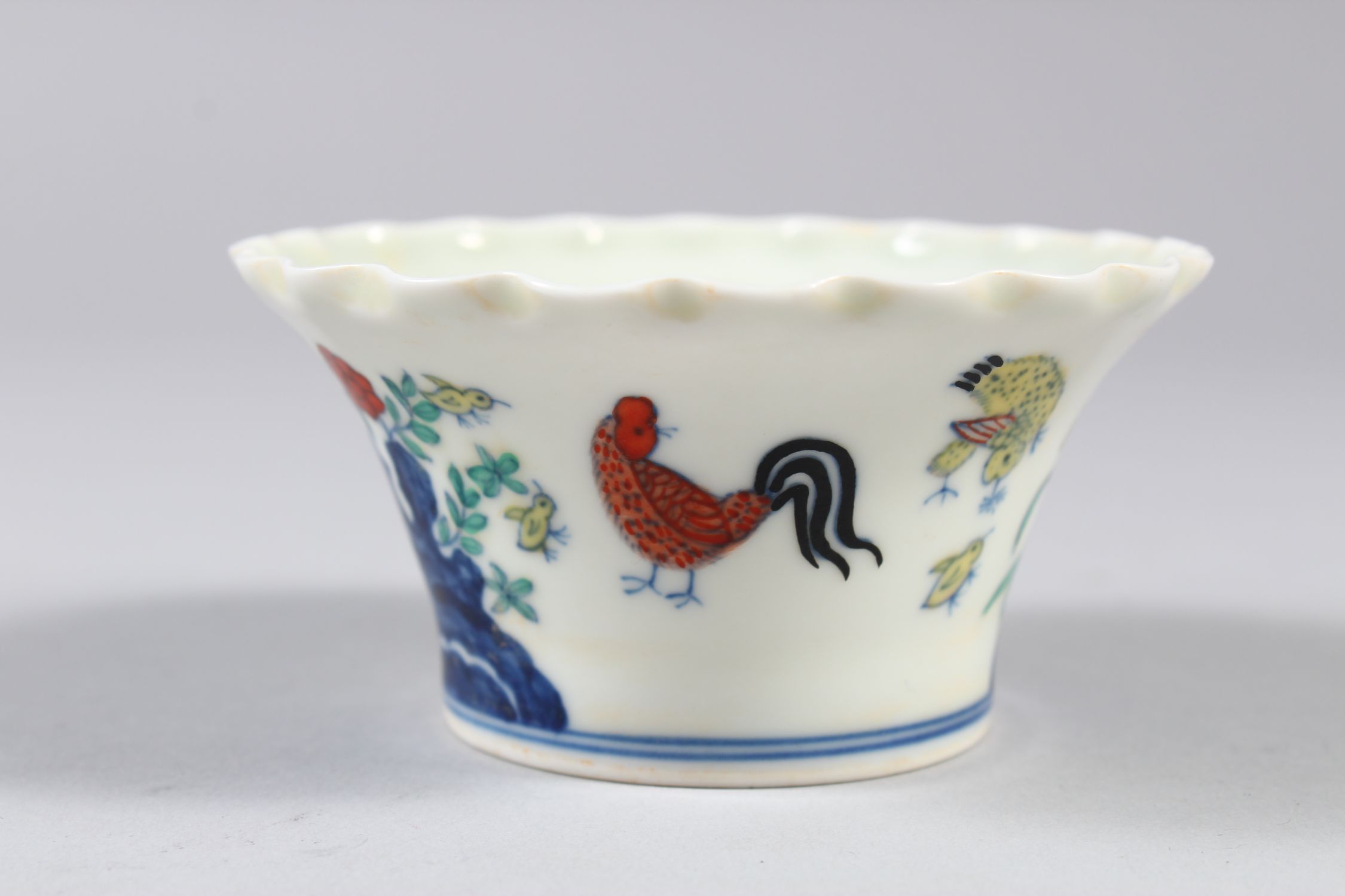 A CHINESE DOUCAI PORCELAIN BOWL, with pleated rim, decorated with roosters and flora, six- - Image 3 of 7