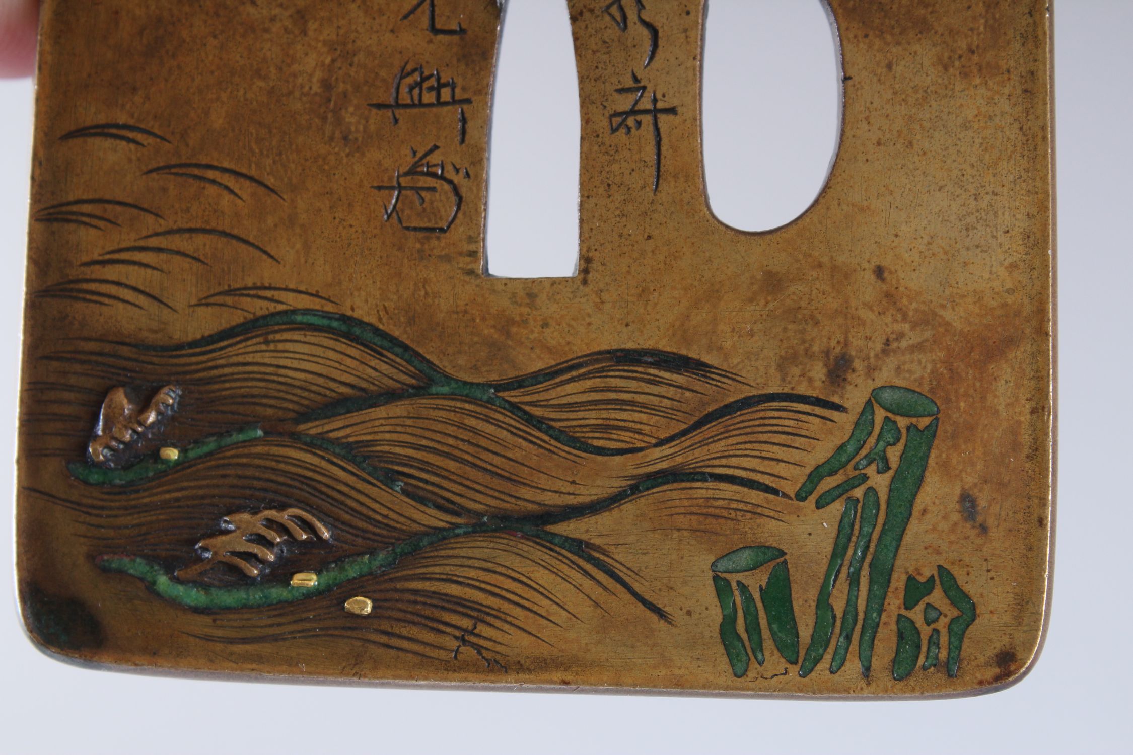 A GOOD JAPANESE EARLY / EDO PERIOD BRONZE, ENAMEL & MIXED METAL TSUBA, carved with scenes of windy - Image 3 of 6