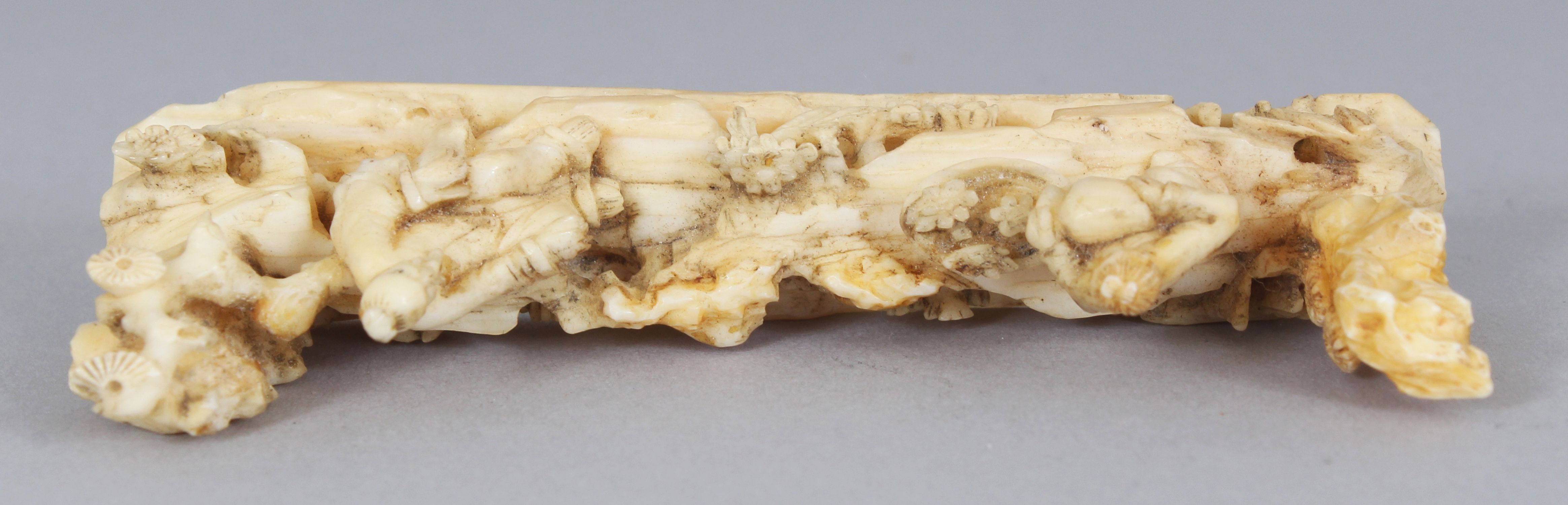 AN UNUSUAL 19TH CENTURY CHINESE IVORY BRUSH REST, carved in the form of a sage and his attendant, - Image 3 of 4