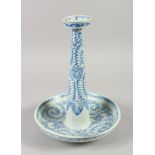 A CHINESE BLUE AND WHITE PORCELAIN CANDLESTICK, with blue vine and leaf decoration all over,