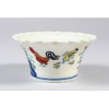 A CHINESE DOUCAI PORCELAIN BOWL, with pleated rim, decorated with roosters and flora, six-
